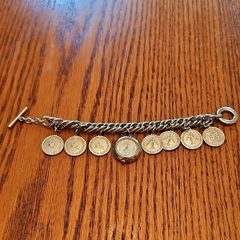 BURBERRY SIlver Coin Charm Bracelet.